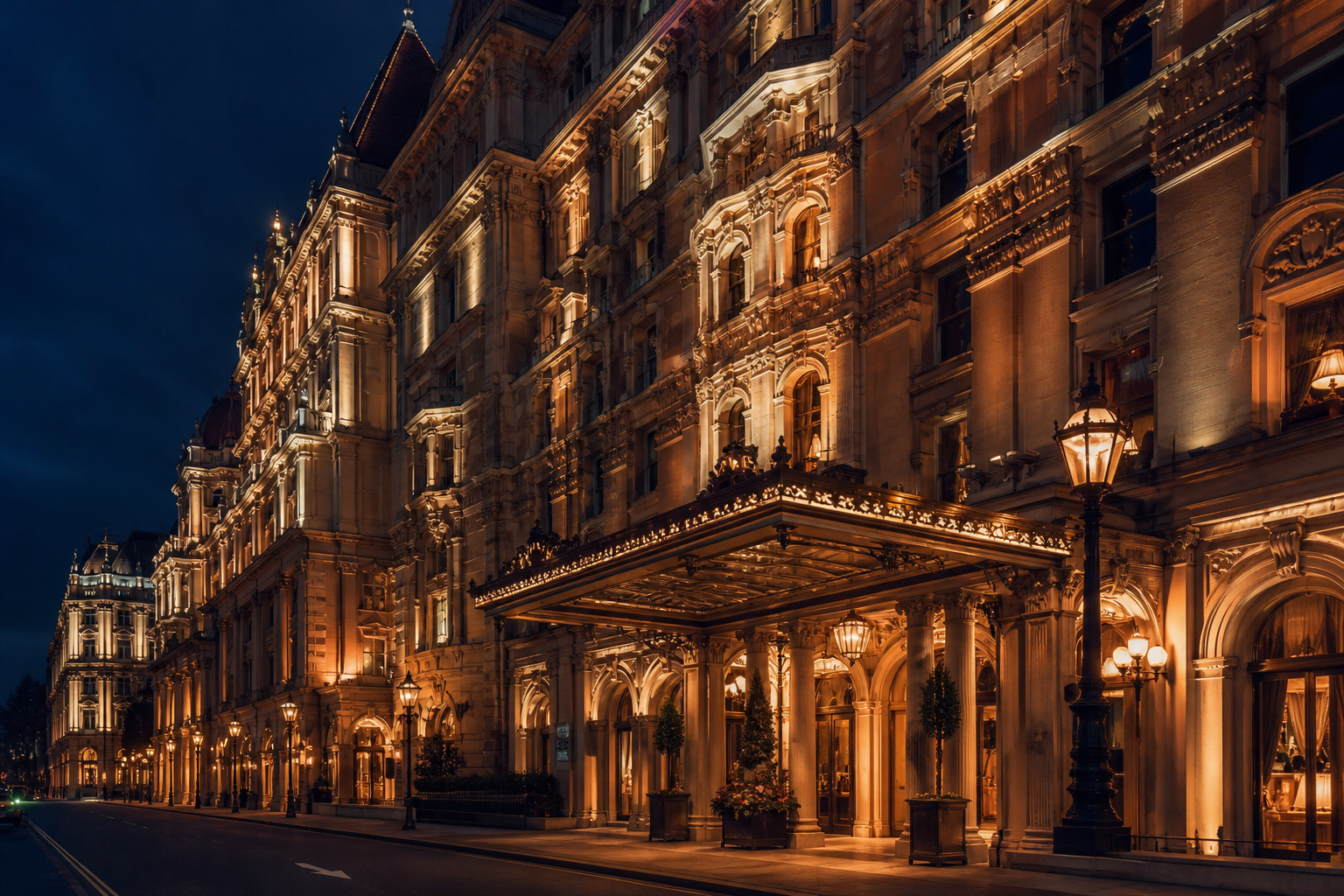 The brass and glass portico of Elite Casino Hotels on Cavendish Row at night